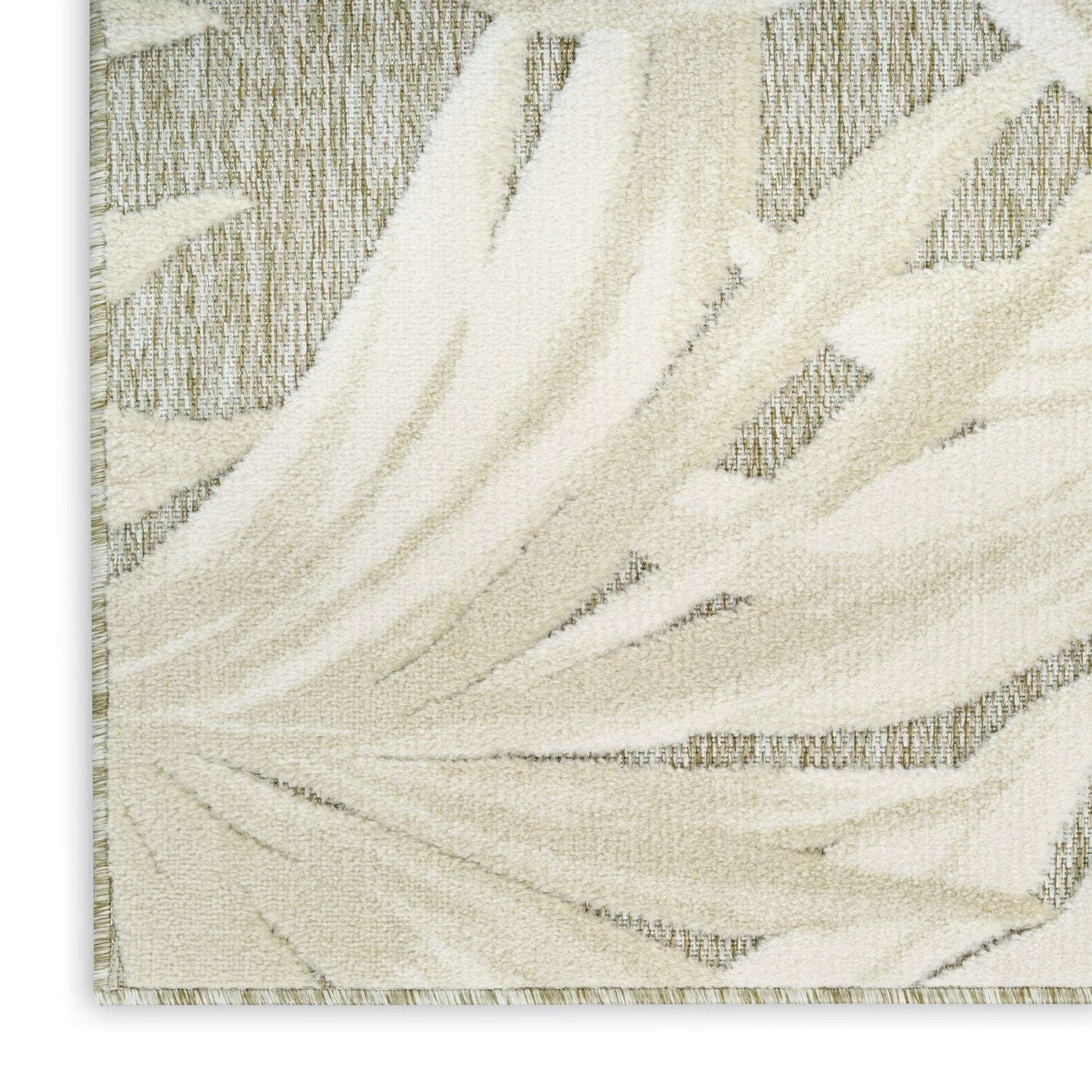 Cream-beige palm-leaf patterned rug with textured pile and light border, modern decorative floor mat.
