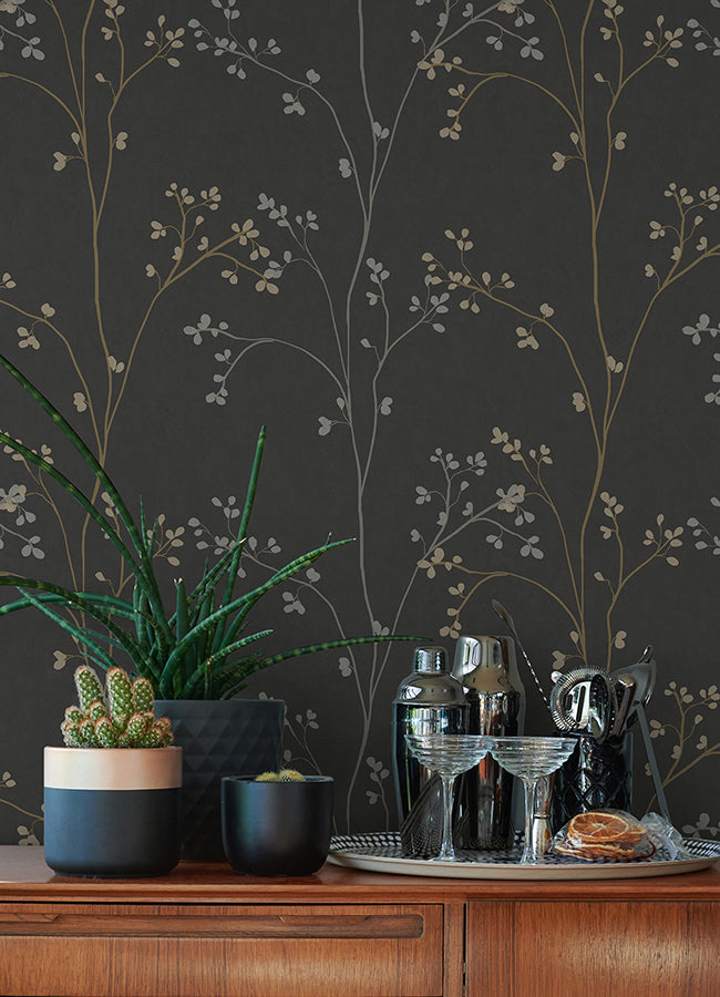 Black peel & stick wallpaper with delicate cherry blossom branches rising over a dark background — removable DIY wallcovering perfect for accent walls, bedrooms, living rooms, or renters seeking stylish, graphic botanical décor.