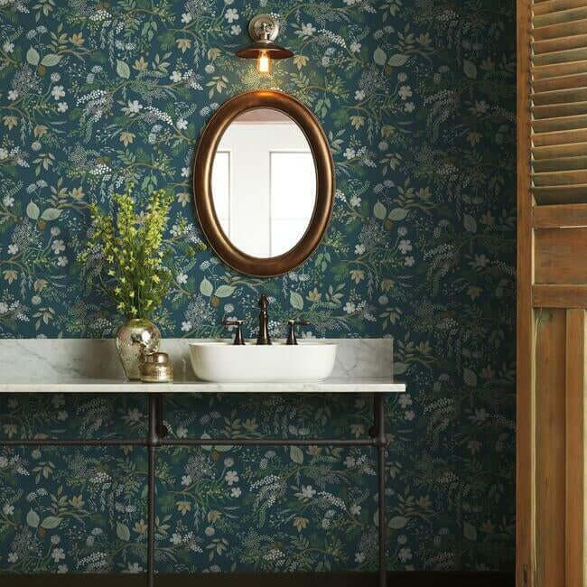 Juniper Forest Wallpaper in Pine by Rifle Paper Co. featuring detailed woodland branches, pinecones, berries, moss, and forest greenery in rich green tones. Luxury botanical wallpaper ideal for accent walls, living rooms, bedrooms, cabins, dining rooms, offices, cottagecore interiors, rustic décor, woodland nurseries, vintage-inspired homes, and nature-themed interior design projects. Premium non-woven wallcovering with layered forest patterns and timeless organic style.