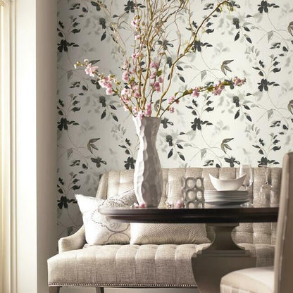 SO2442 Linden Flower Black wallpaper — black floral pattern on soft light neutral background, shown as accent wall in a Dining room, ideal for botanical and elegant interior décor.