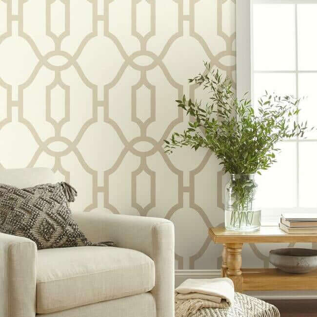 Woven Trellis wallpaper by Magnolia Home featuring oversized geometric trellis patterns in soft beige tones with a structured modern design. A removable SureStrip™ wallpaper ideal for accent walls, bedrooms, living rooms, dining rooms, and farmhouse or transitional interior design styles.