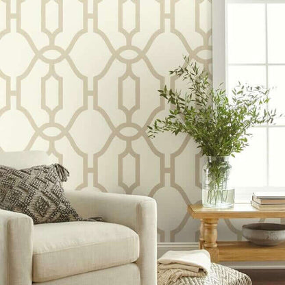 Woven Trellis wallpaper by Magnolia Home featuring oversized geometric trellis patterns in soft beige tones with a structured modern design. A removable SureStrip™ wallpaper ideal for accent walls, bedrooms, living rooms, dining rooms, and farmhouse or transitional interior design styles.