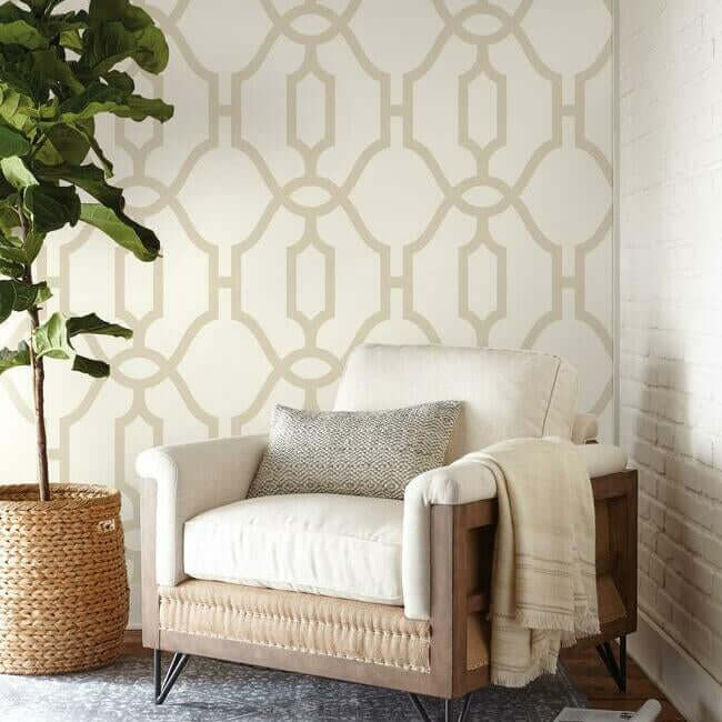 Woven Trellis wallpaper by Magnolia Home featuring oversized geometric trellis patterns in soft beige tones with a structured modern design. A removable SureStrip™ wallpaper ideal for accent walls, bedrooms, living rooms, dining rooms, and farmhouse or transitional interior design styles.