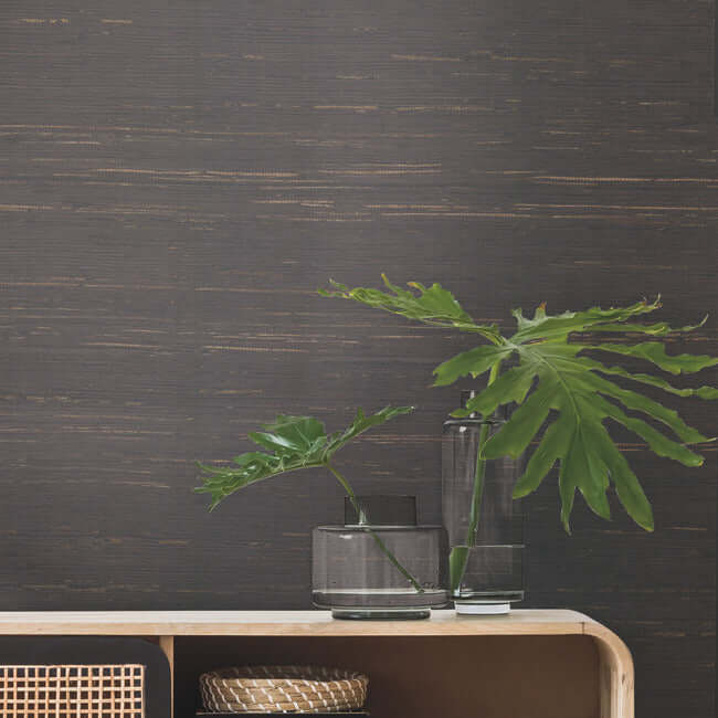 Inked Grass Wallpaper in charcoal featuring slender, knotted grass leaves with a natural textured appearance. Luxury grasscloth wallpaper for sophisticated modern interiors.