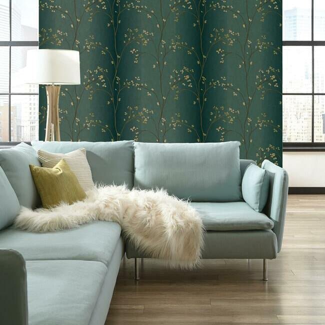 York Wallcoverings Earthy Tones Vertical Blossoms Teal Metallic Wallpaper (BR6224) displayed on a  living room accent wall — vertical blossoms in teal and metallic tones, textured botanical wallcovering, elegant floral design, metallic sheen wallpaper for luxe interior, ideal for accent walls in bedrooms or dining rooms.