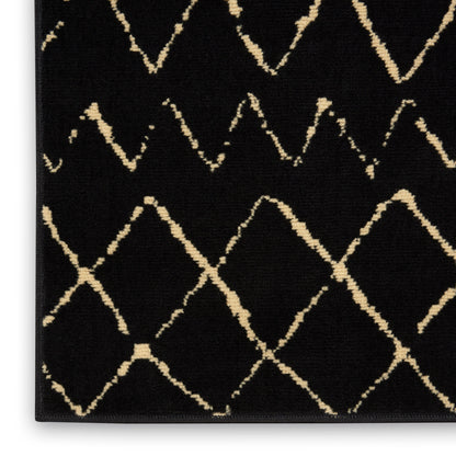 Black rug with beige diamond lattice pattern; modern short-pile area rug.