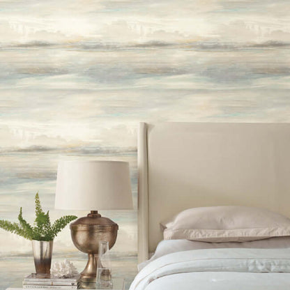 Soothing Mists Scenic Wallpaper in Multi featuring a watercolor landscape mural with soft light blue tones, rolling hills, drifting mist, cloudy dawn sky, and serene nature scenery. Elegant non-woven scenic wallpaper ideal for bedrooms, living rooms, dining rooms, home offices, coastal interiors, farmhouse décor, cottagecore spaces, accent walls, luxury home design, wall mural installations, and modern interior decorating projects.