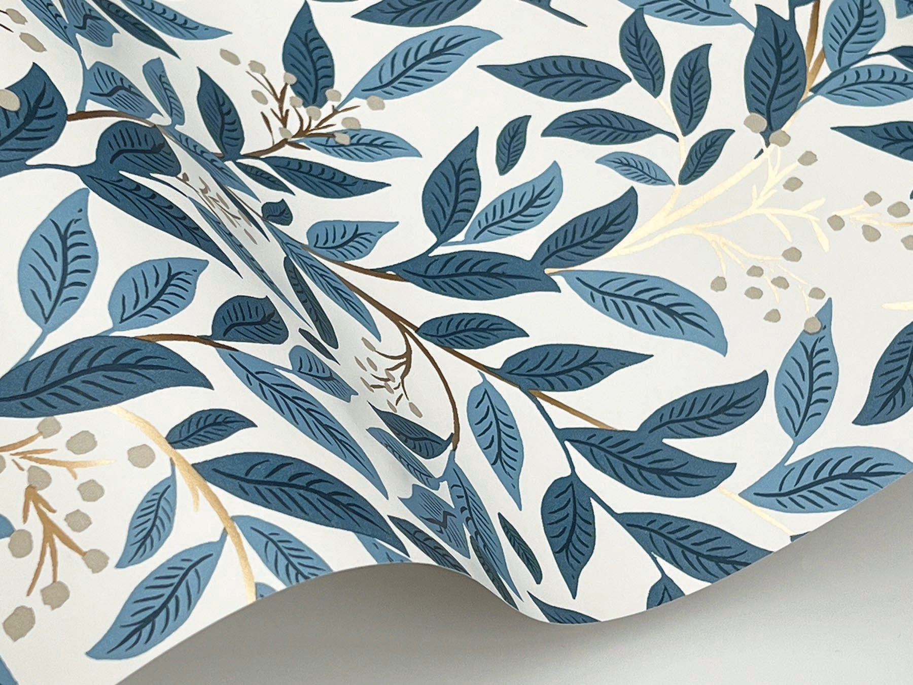 Lush vine and metallic berry floral wallpaper in blue by Rifle Paper Co, pattern RF7461 from the Third Edition, non-woven washable wallcovering.