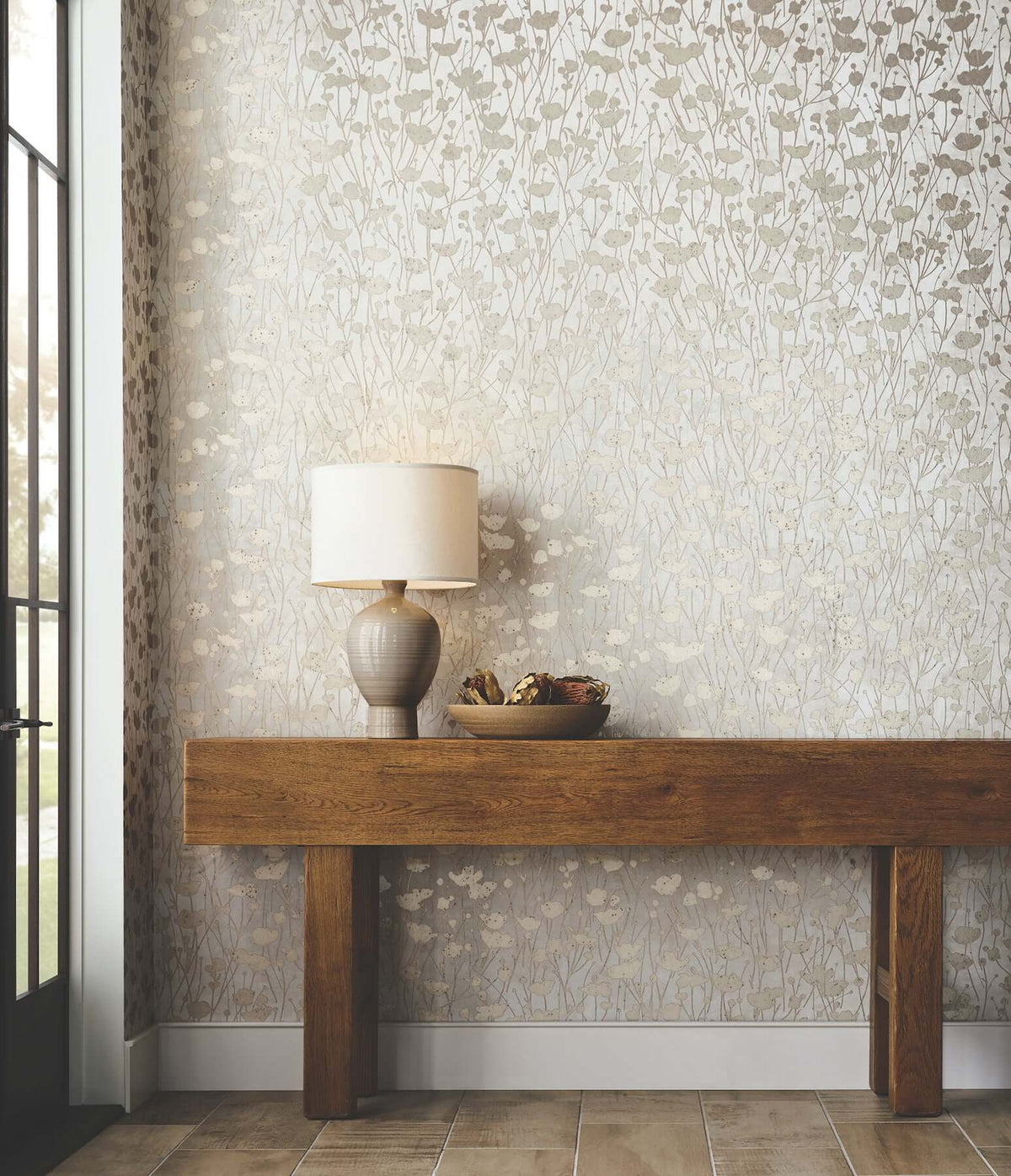 White and gold Shimmering Poppies Wallpaper featuring delicate poppy flowers and fine stems scattered across a soft white background. Elegant metallic botanical wallpaper for refined and contemporary interiors.