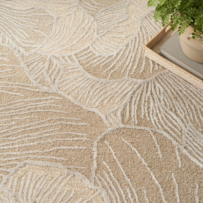 Beige textured rug with cream palm-leaf pattern; modern home decor with a small plant on a tray.