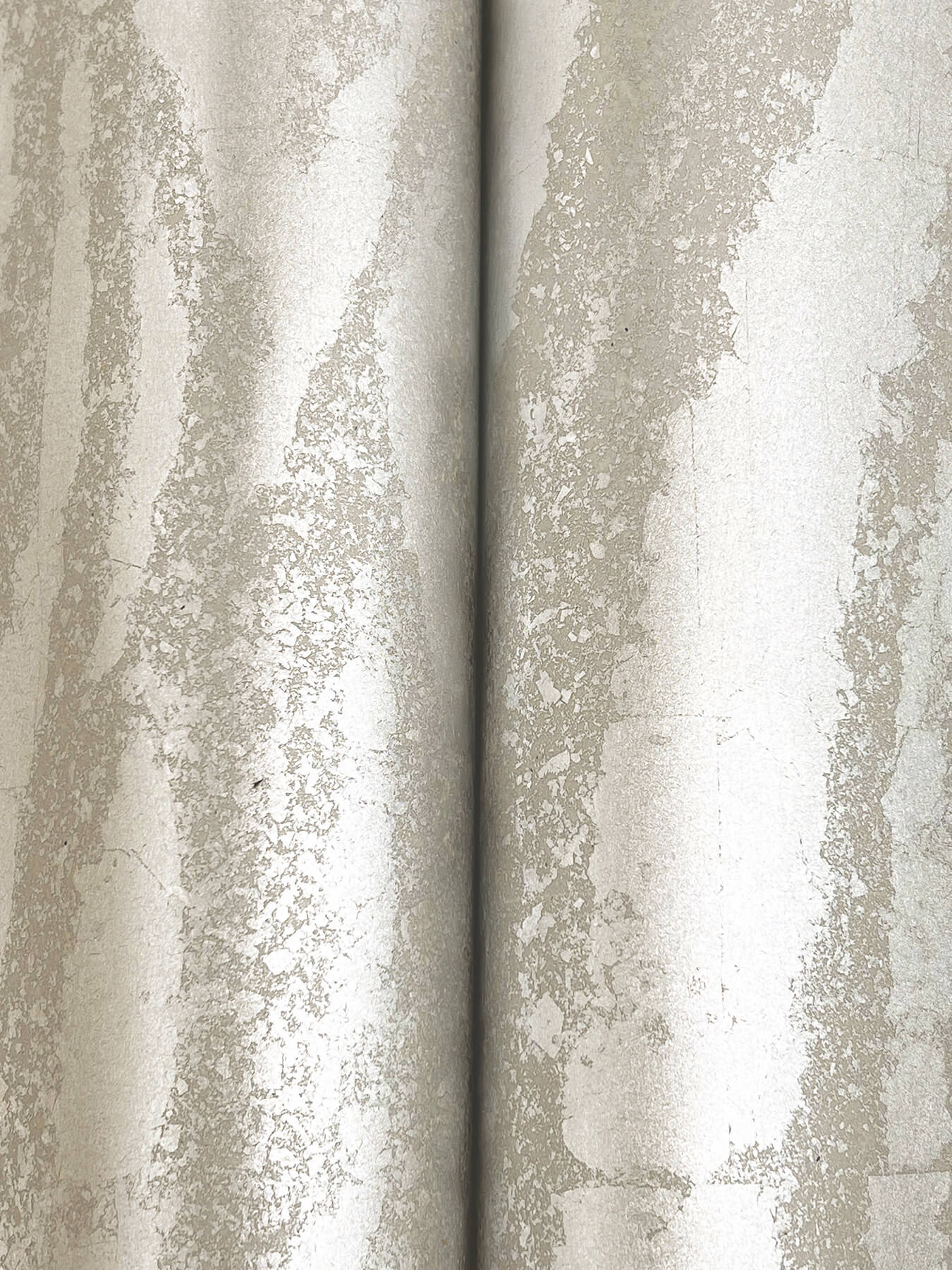 Silver Zebra Chic Wallpaper featuring a metallic zebra-inspired animal print design with reflective foil accents. Luxury designer wallpaper for modern living rooms, bedrooms, dining rooms, powder rooms, accent walls, contemporary interiors, glam decor, wall coverings, home renovation projects, and elegant statement walls.