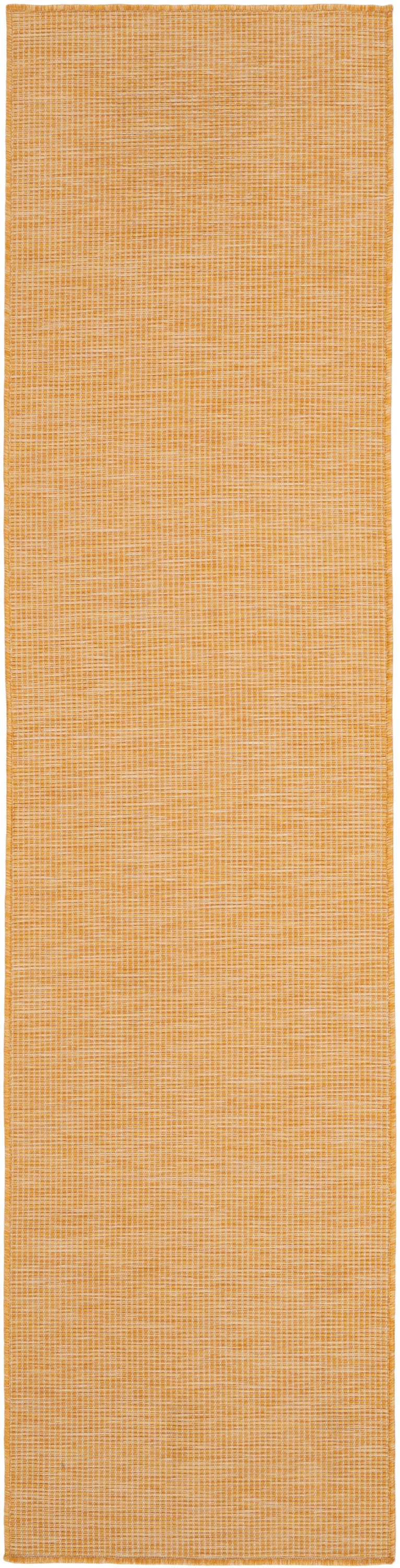Orange woven hallway runner rug with a subtle grid pattern and stitched border.
