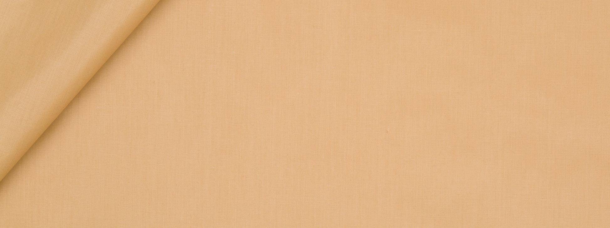 Beige fabric with a soft top-left fold, smooth texture, warm neutral tone.