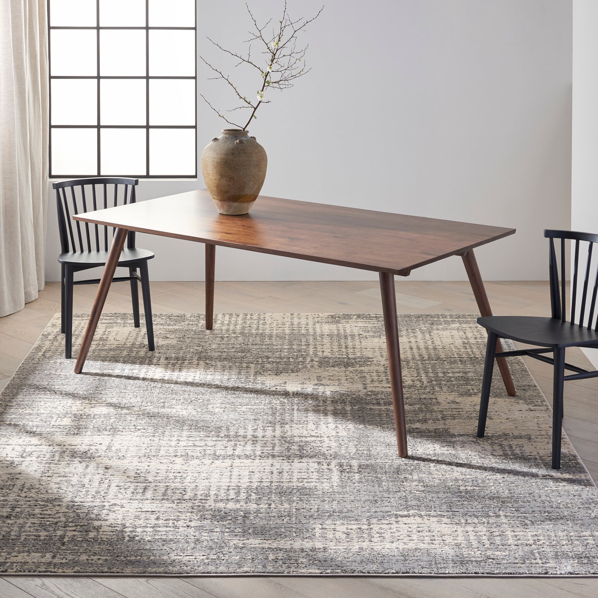 Modern gray rug with a subtle pattern, 10' x 14'.