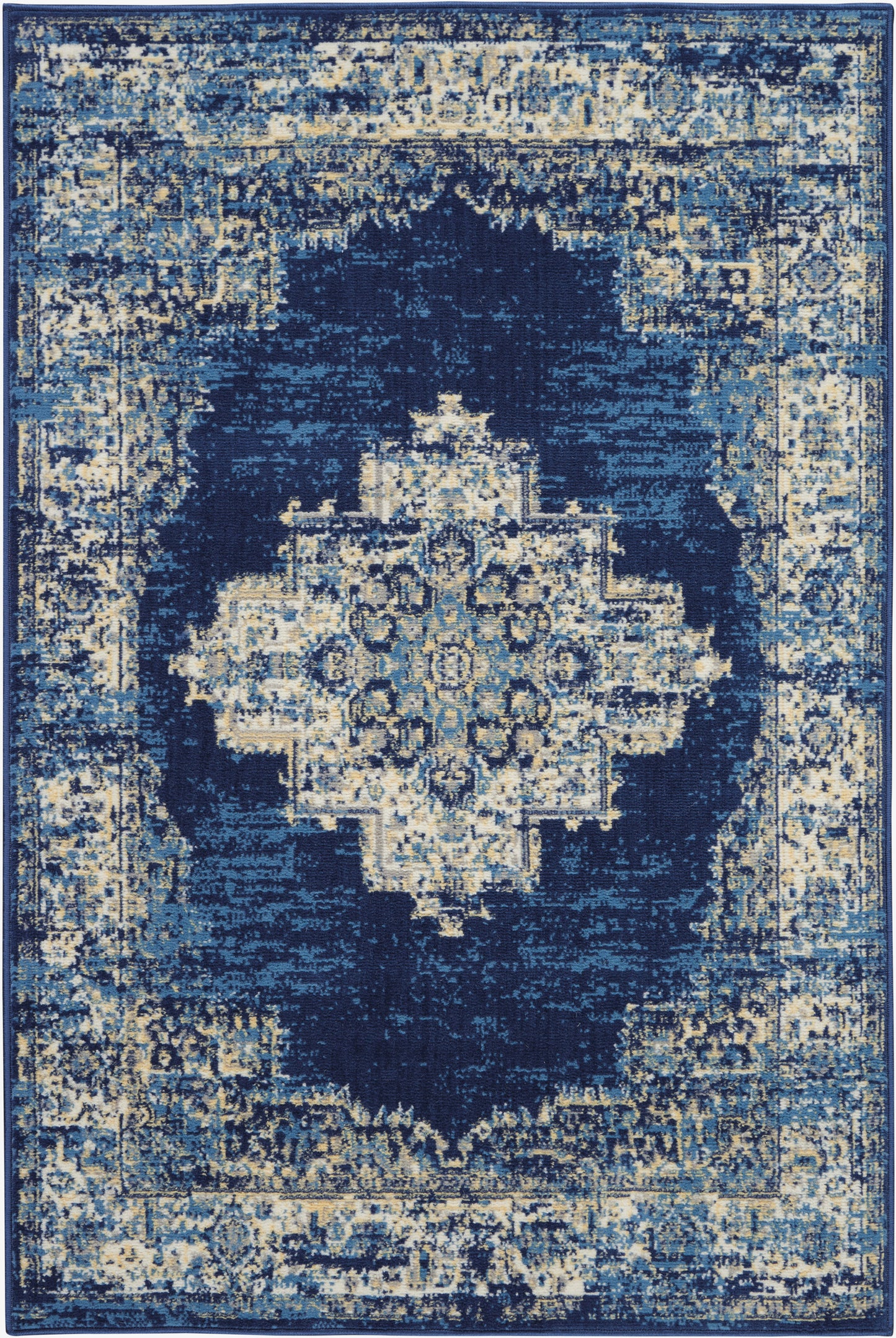 Blue distressed oriental rug with ivory central medallion and ornate navy border in cream and blue tones.