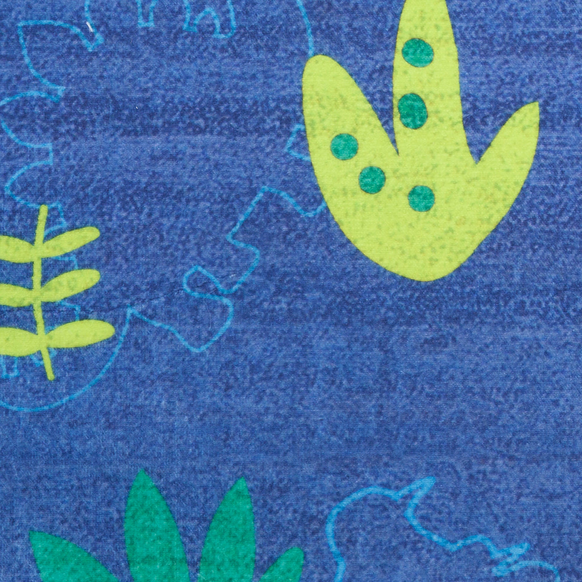 Blue rug with lime-green leaf shapes and teal dots in an abstract botanical pattern.
