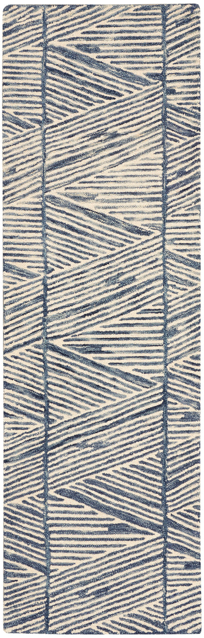 Navy blue geometric woven rug runner on ivory, textured chevron pattern.