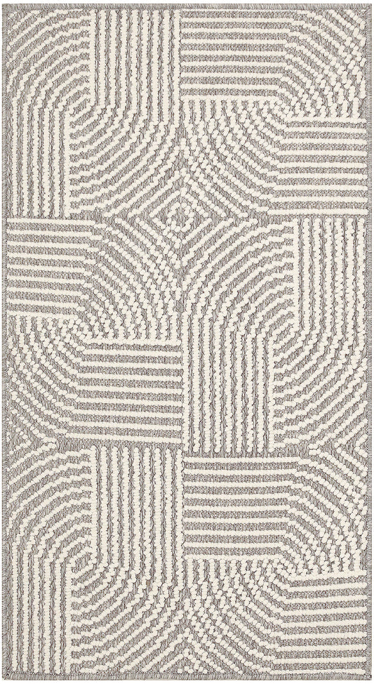Cream and gray tufted rug with geometric patchwork and radiating line textures.