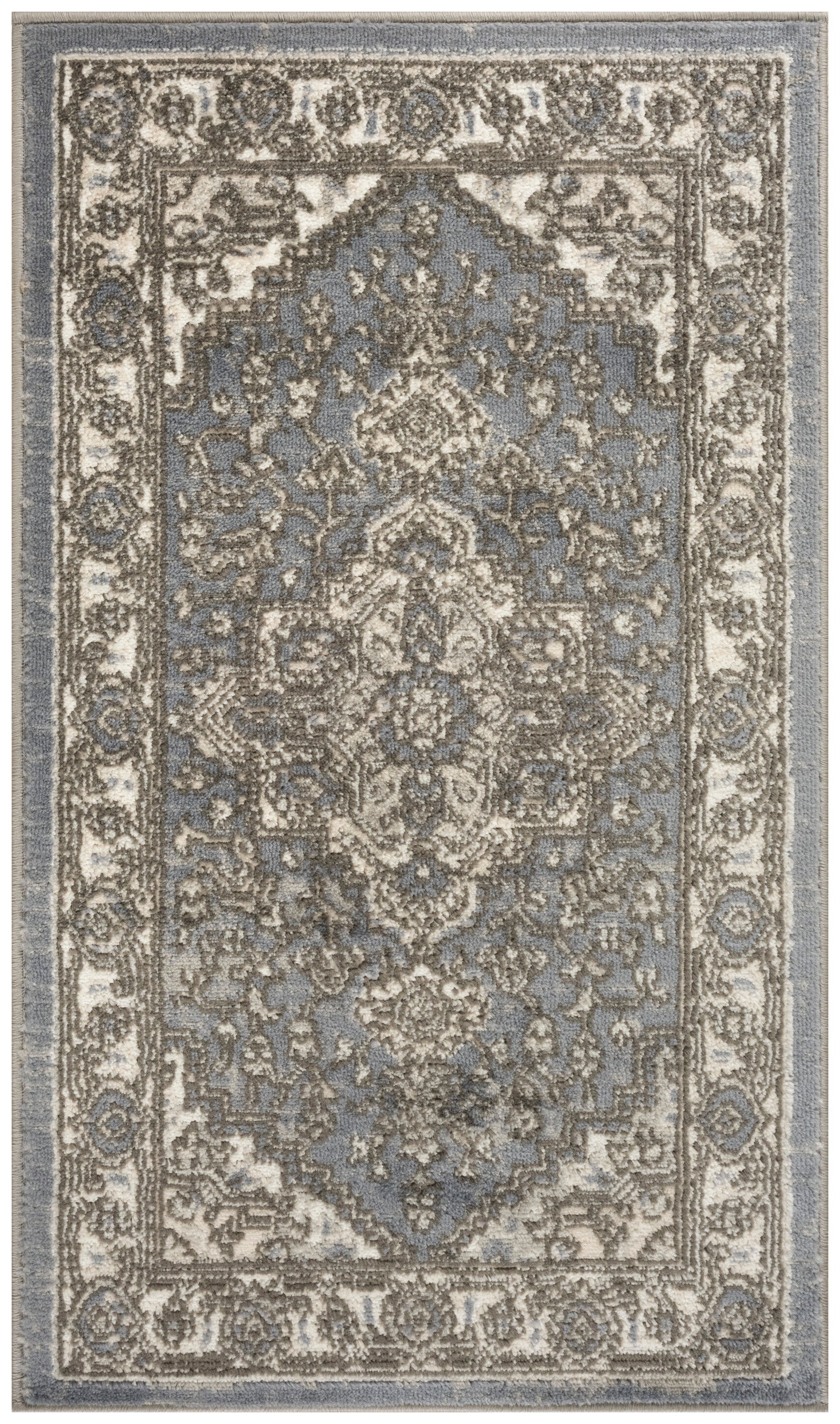 Blue-gray oriental rug with beige central medallion and ornate floral border.
