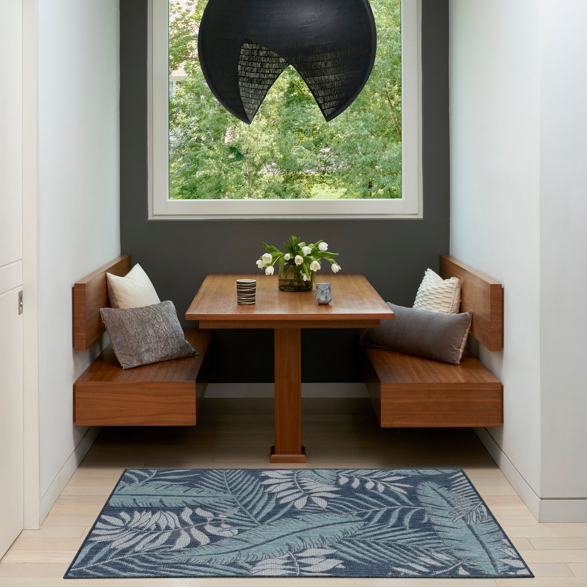 Blue tropical-pattern rug, 3' x 5'.