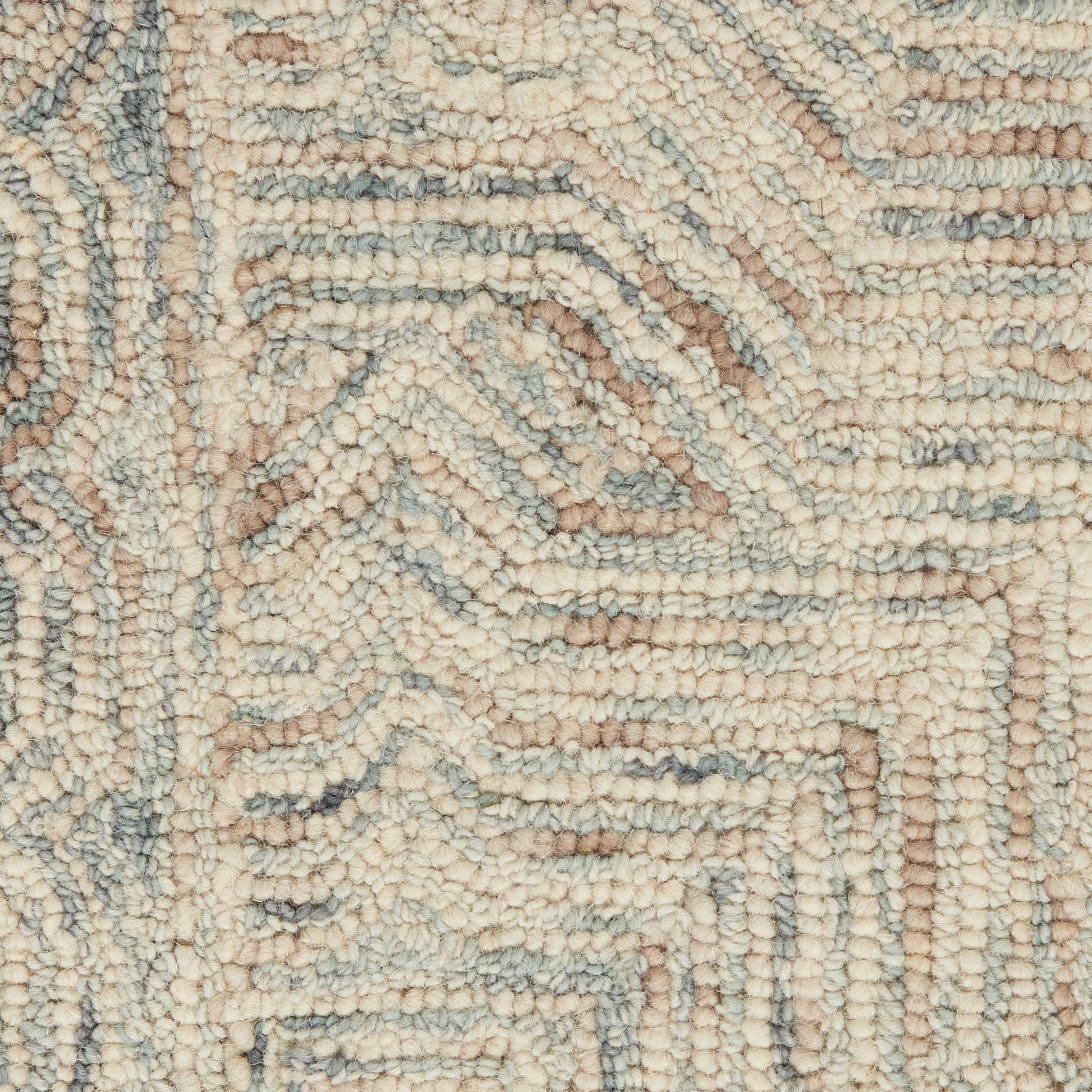 Cream boucle rug with pale blue geometric maze pattern, textured loop pile.
