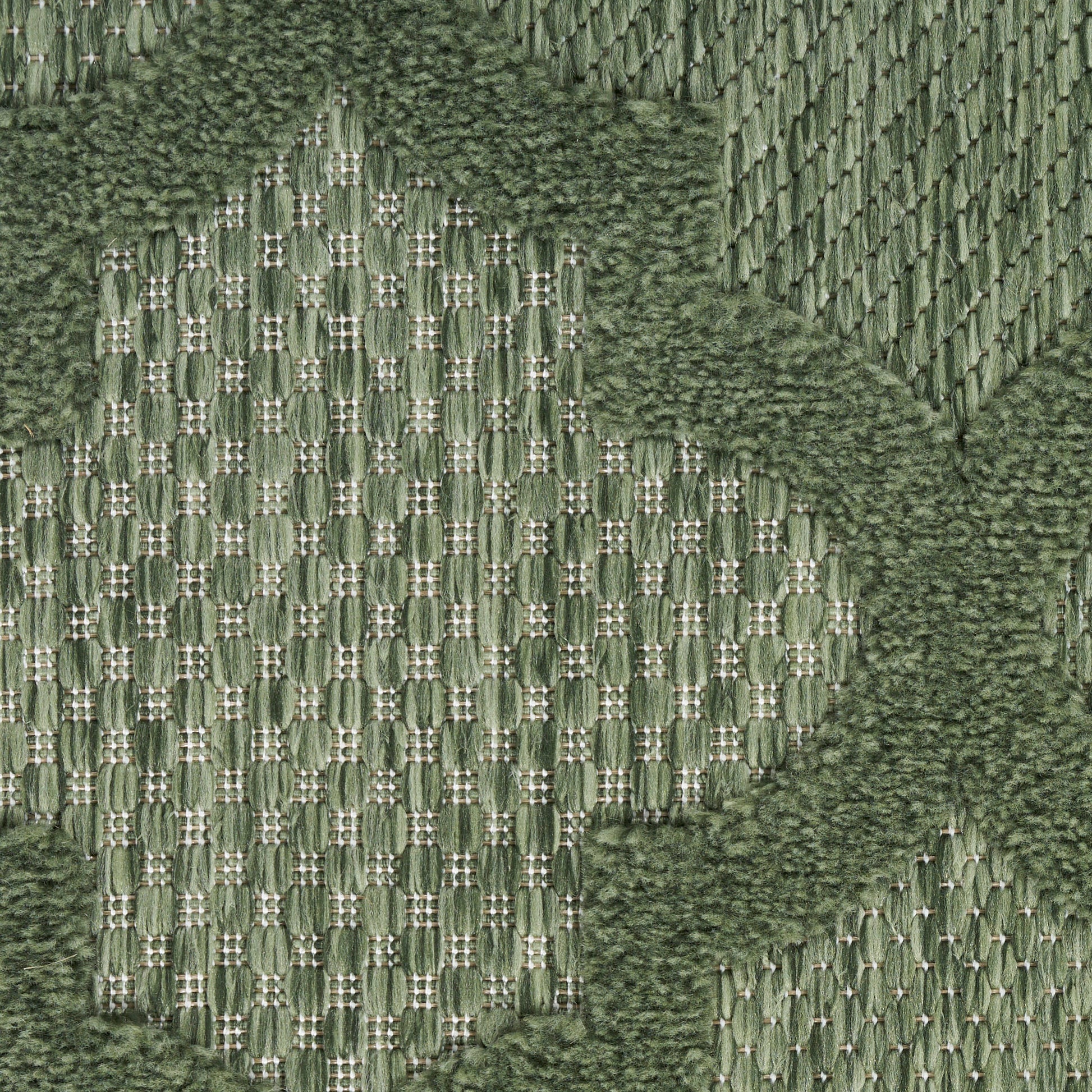 Olive green woven rug with cream lattice pattern and shaggy moss border; durable textile flooring.