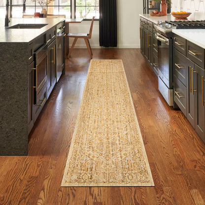 Beige oriental-patterned runner rug on dark hardwood kitchen floor between black cabinets.