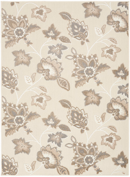 Beige floral area rug with taupe-gray blossoms and vines; classic woven texture.
