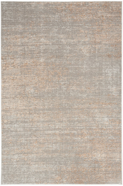 Neutral gray and beige distressed area rug with a soft, faded pattern.