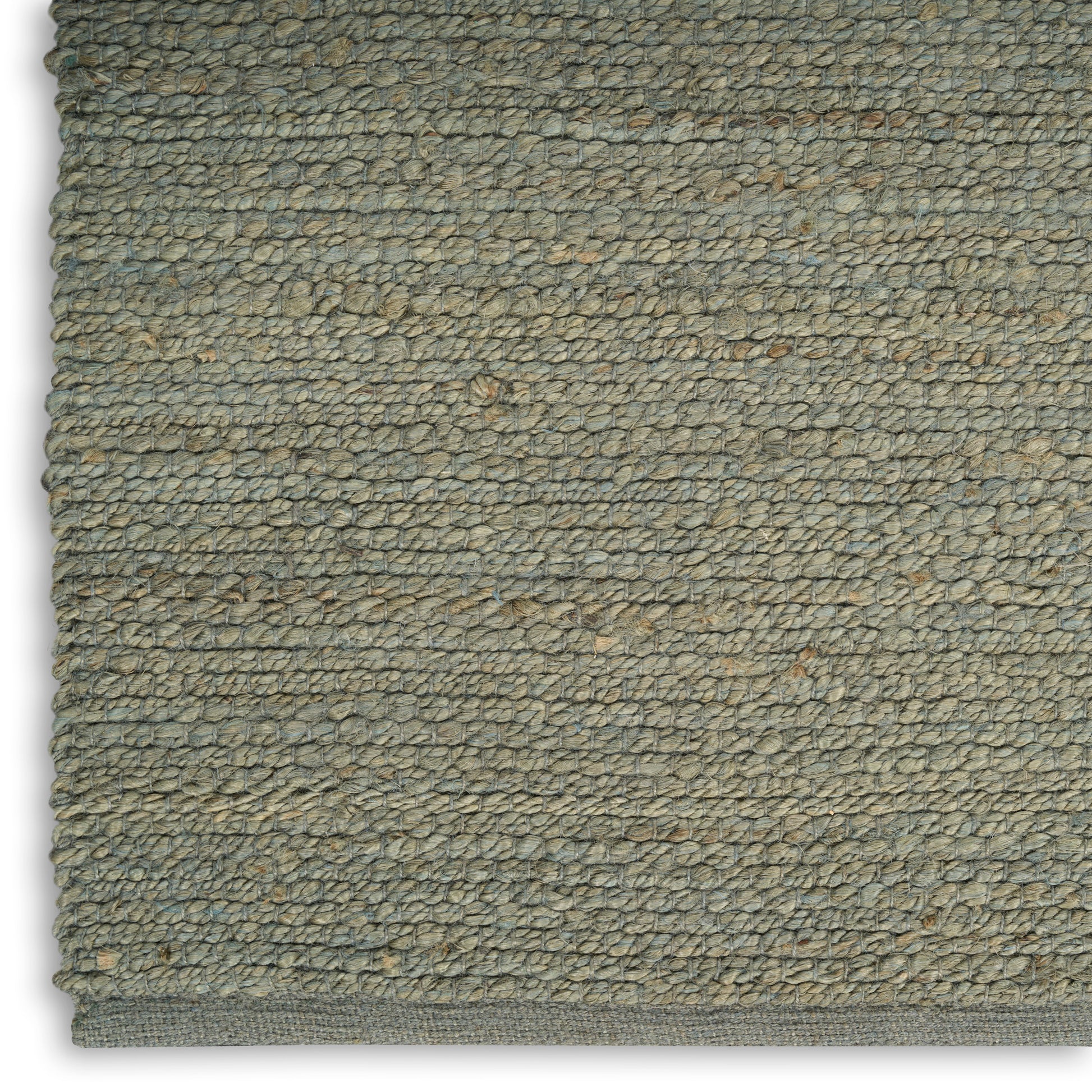 Close-up of olive-gray loop-pile rug texture with speckled fibers and a bound edge.