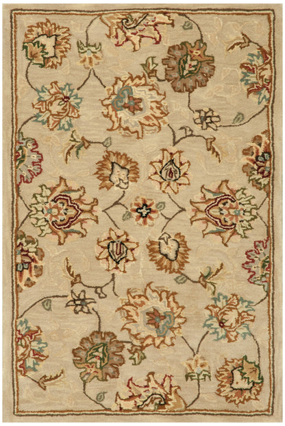 Rectangular woven rug with cream background and traditional floral pattern in teal, rust, green, and brown.
