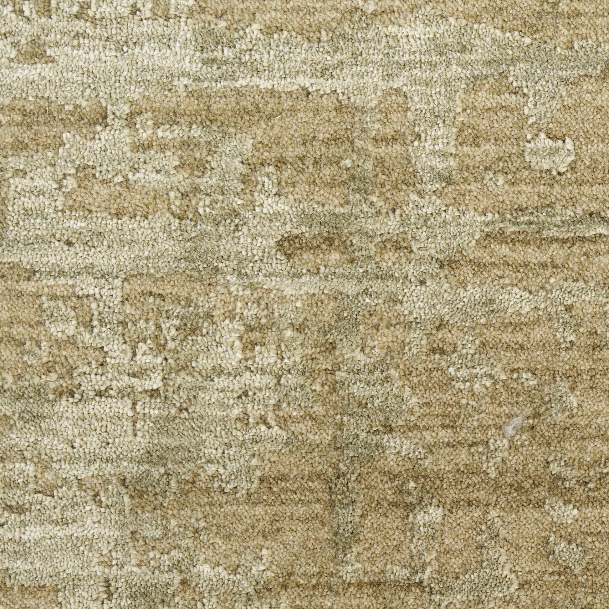 Beige and tan textured rug with a soft woven pile and subtle abstract pattern.