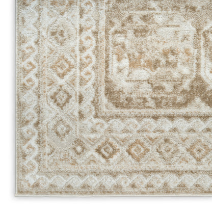 Beige and ivory rug with distressed antique motifs and geometric borders; rectangular shape, soft plush finish.