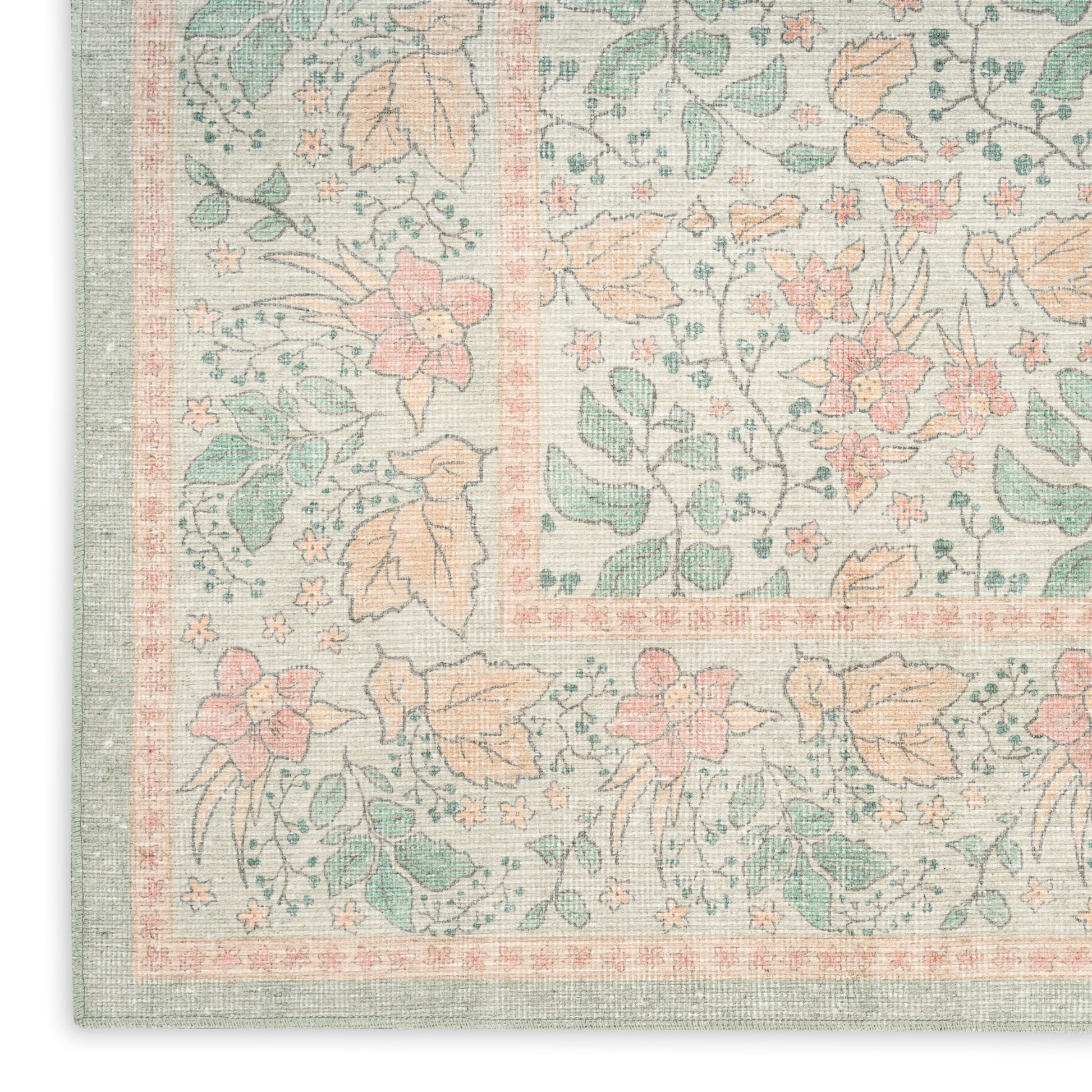 Pastel floral area rug with mint border and peach blossoms on ivory background in a vintage damask-inspired pattern.