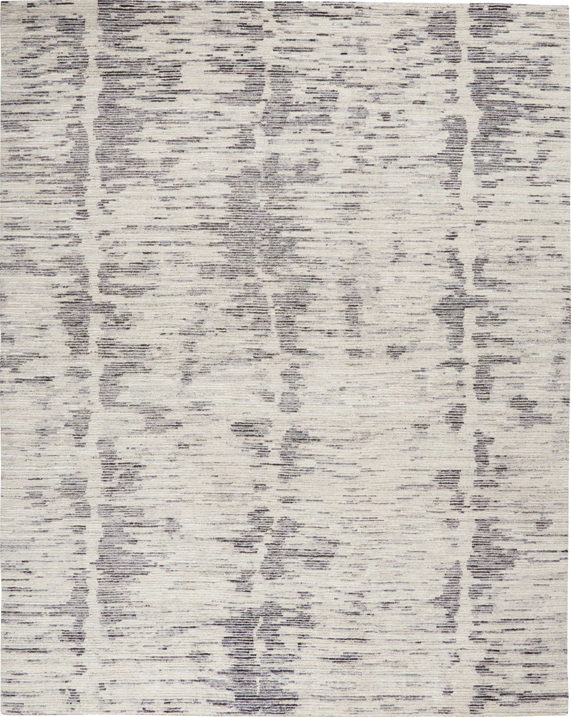 Rectangular area rug with cream base and gray distressed abstract pattern; soft, textured, modern decor.