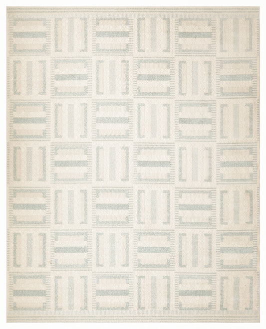 Light beige woven rug with pale blue-gray tile-like blocks in a grid; modern geometric design.