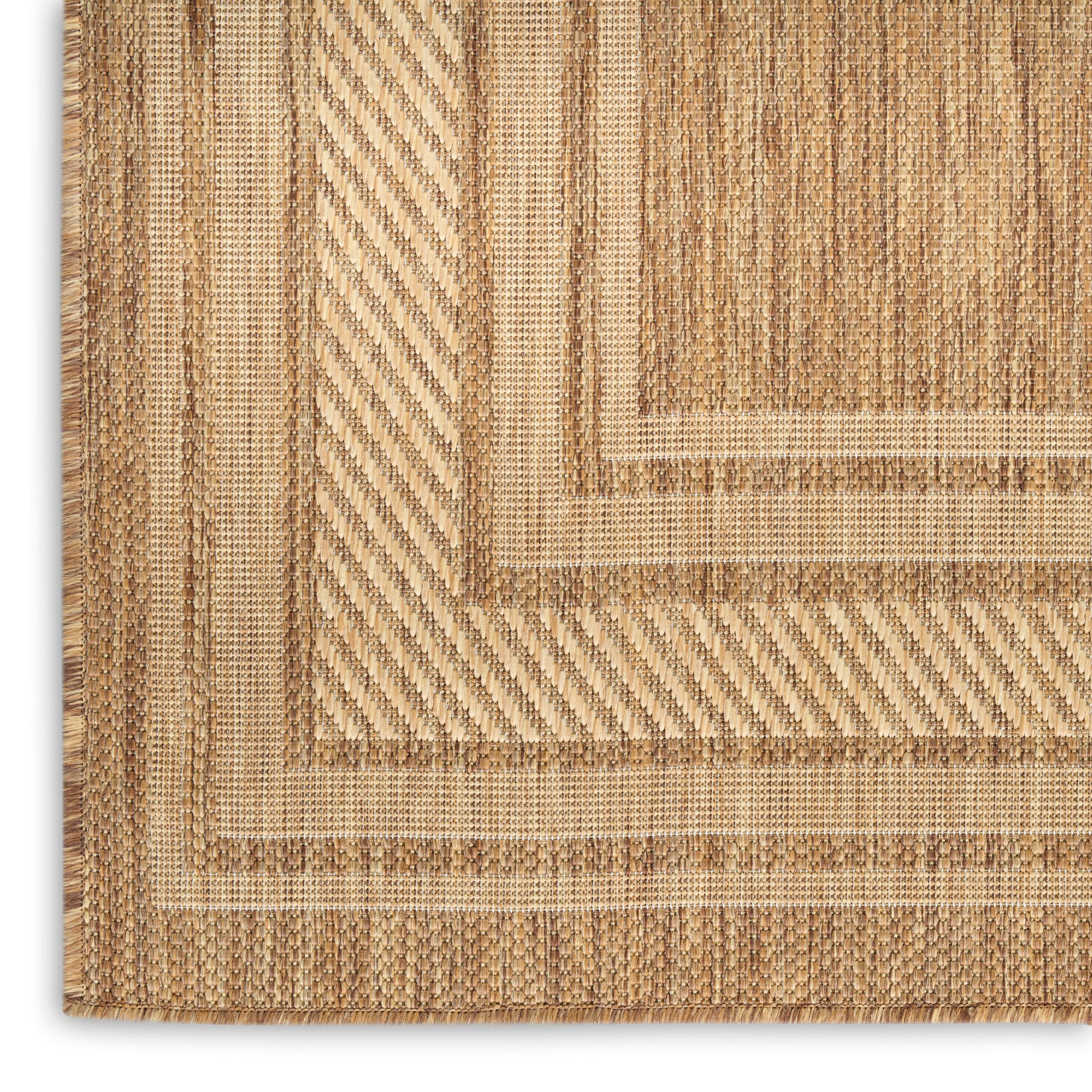 Natural jute rug with layered beige borders and herringbone diagonal weave.