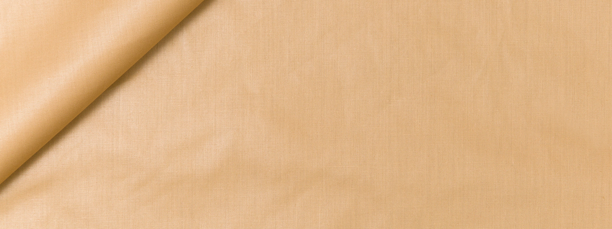 Beige fabric close-up with a soft fold, smooth linen/cotton texture, warm tan color for apparel or upholstery.