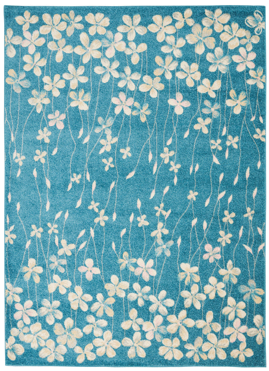 Turquoise-blue area rug with cream floral vines, soft tufted pile, rectangular, perfect for living rooms.
