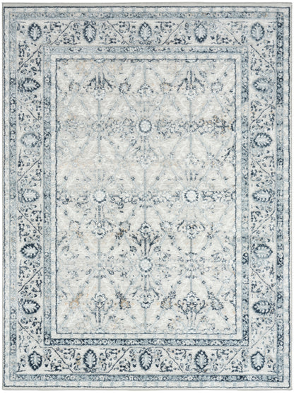 Rectangular grey-blue distressed Oriental rug with antiqued floral motifs and decorative border.