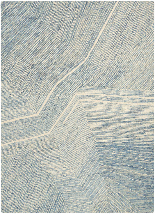 Blue & ivory geometric rug with angular chevron lines and subtle texture.