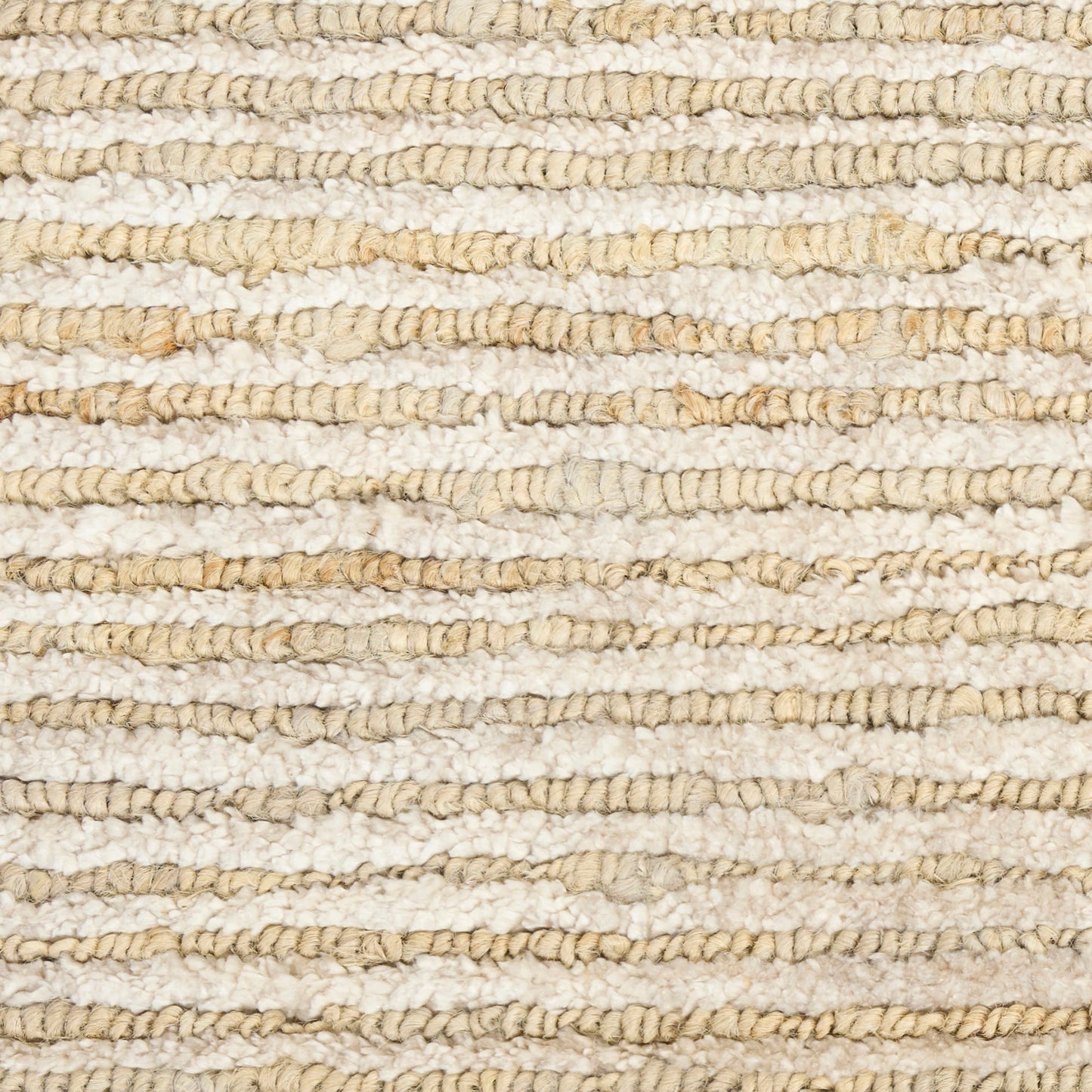 Close-up of a cream and beige boucle rug with chunky looped fibers and subtle horizontal bands.