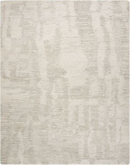 Cream textured area rug with subtle taupe abstract pattern & rectangular shape, soft woven texture for modern decor.