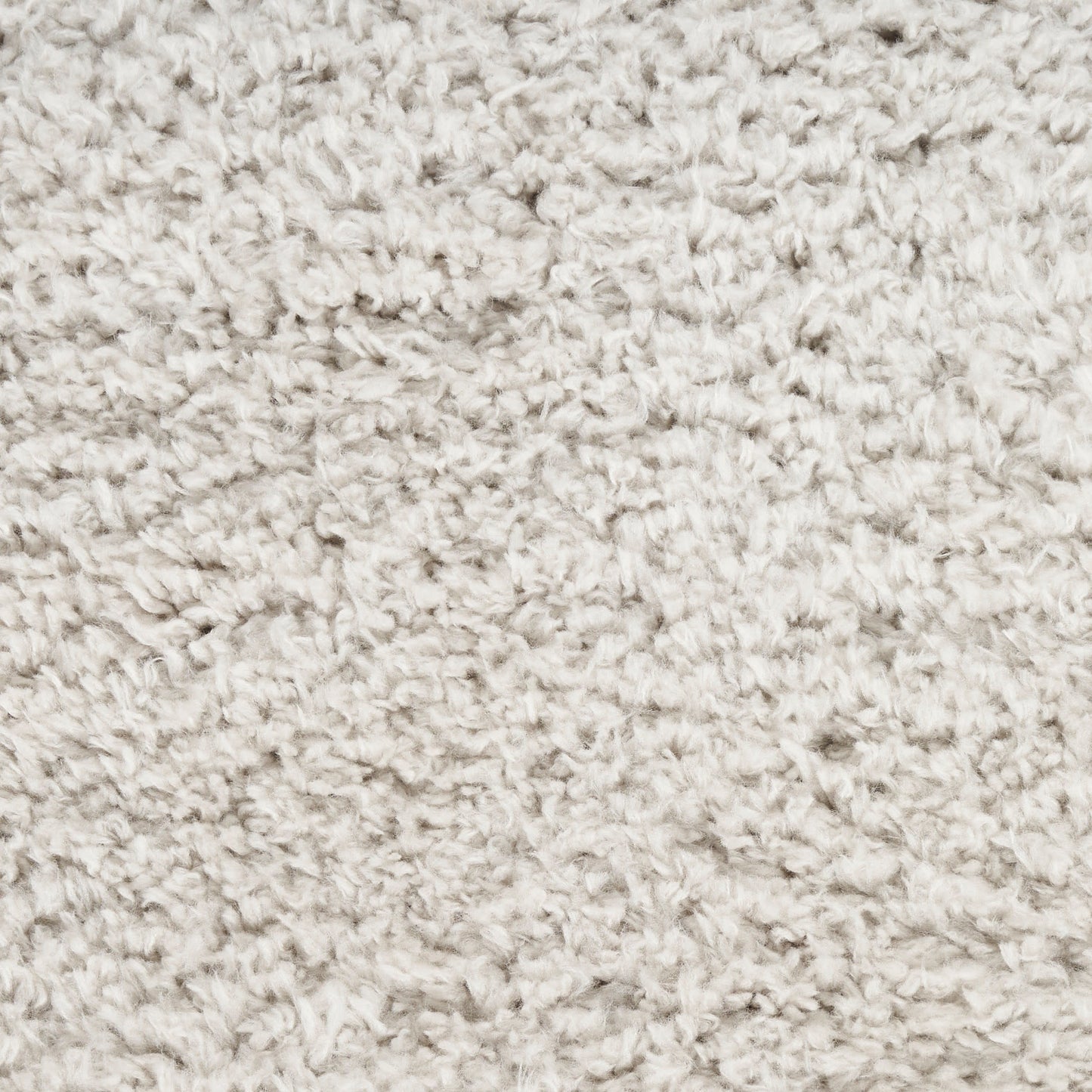 Beige fluffy shag rug texture with soft, curly pile close-up.