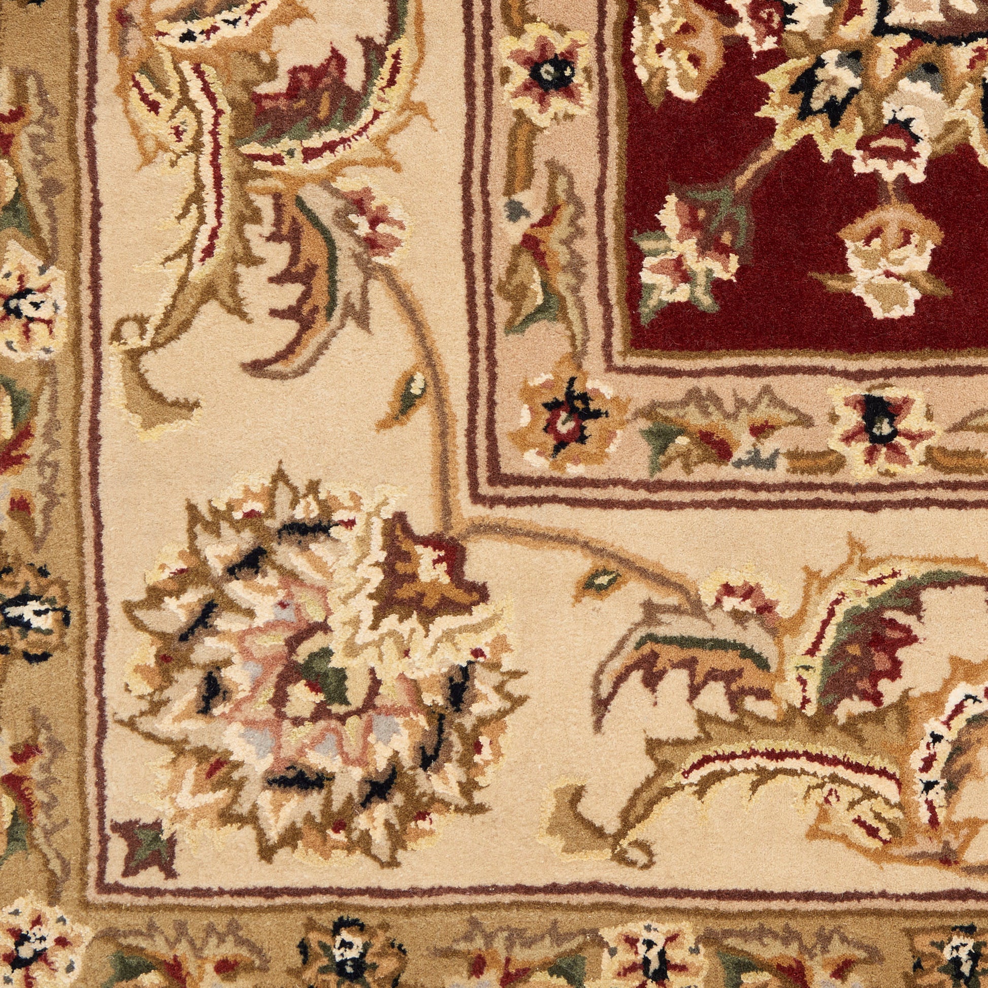 Beige oriental rug with red central medallion and ornate floral border; gold, cream and burgundy tones.
