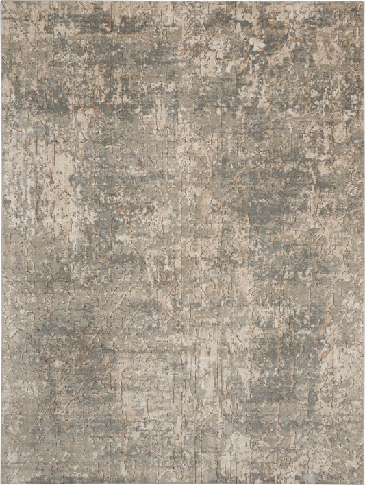 Rectangular area rug in muted taupe, gray and beige with abstract distressed pattern and modern vibe.