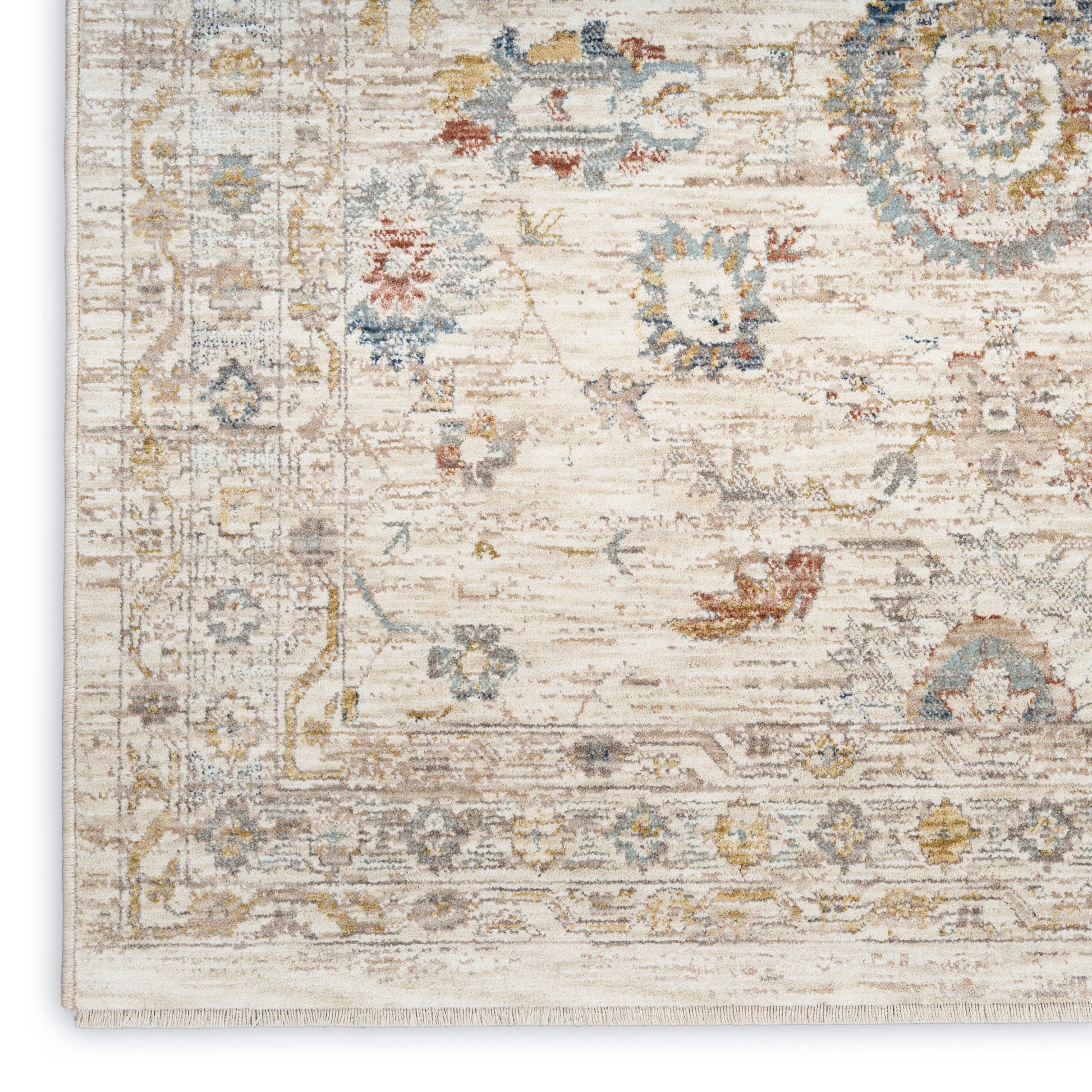 Ivory distressed oriental rug with pale blue, gold & gray floral motifs and decorative border.
