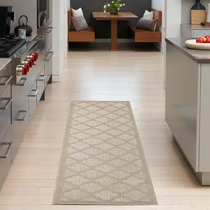 Beige woven rug runner with a diamond lattice pattern on a light wood kitchen floor, guiding to a dining nook.