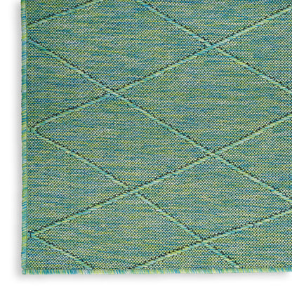 Teal-green woven rug with diagonal diamond lattice pattern and textured knotted surface.