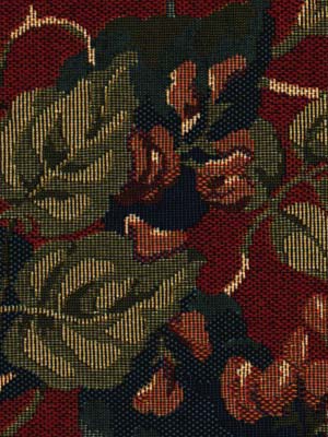 Tapestry-style floral fabric with olive-green leaves on a deep red background and dark blue and peach flowers.